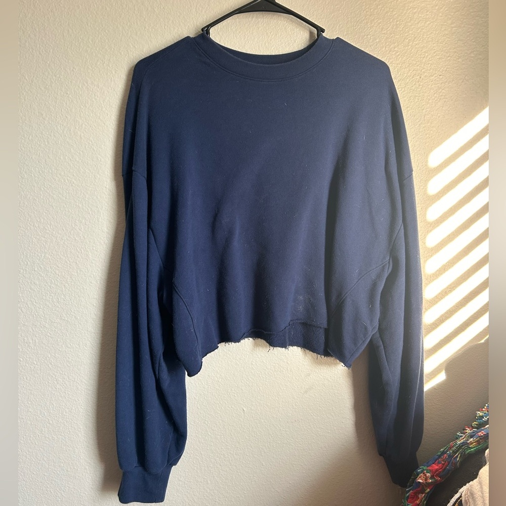 Pink cropped navy blue sweater with pink printed on size with florals size med